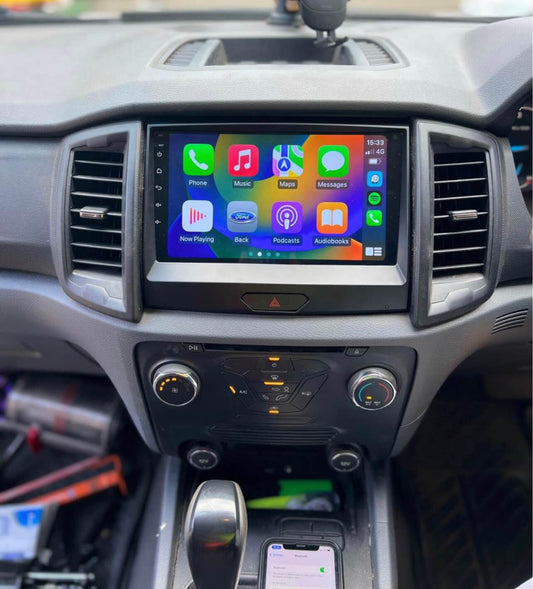 Car dashboard with a touchscreen display showing smartphone integration interface.