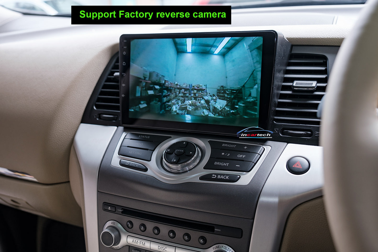 Car dashboard with a reversing camera display and control panel.
