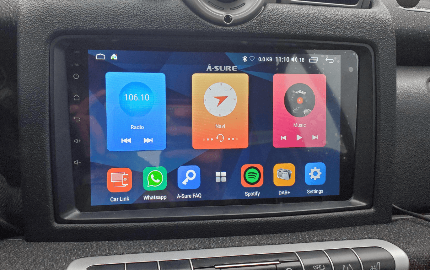 Car dashboard with a touchscreen display showing various app icons.