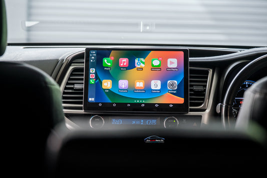 Car dashboard with a touchscreen display showing app icons