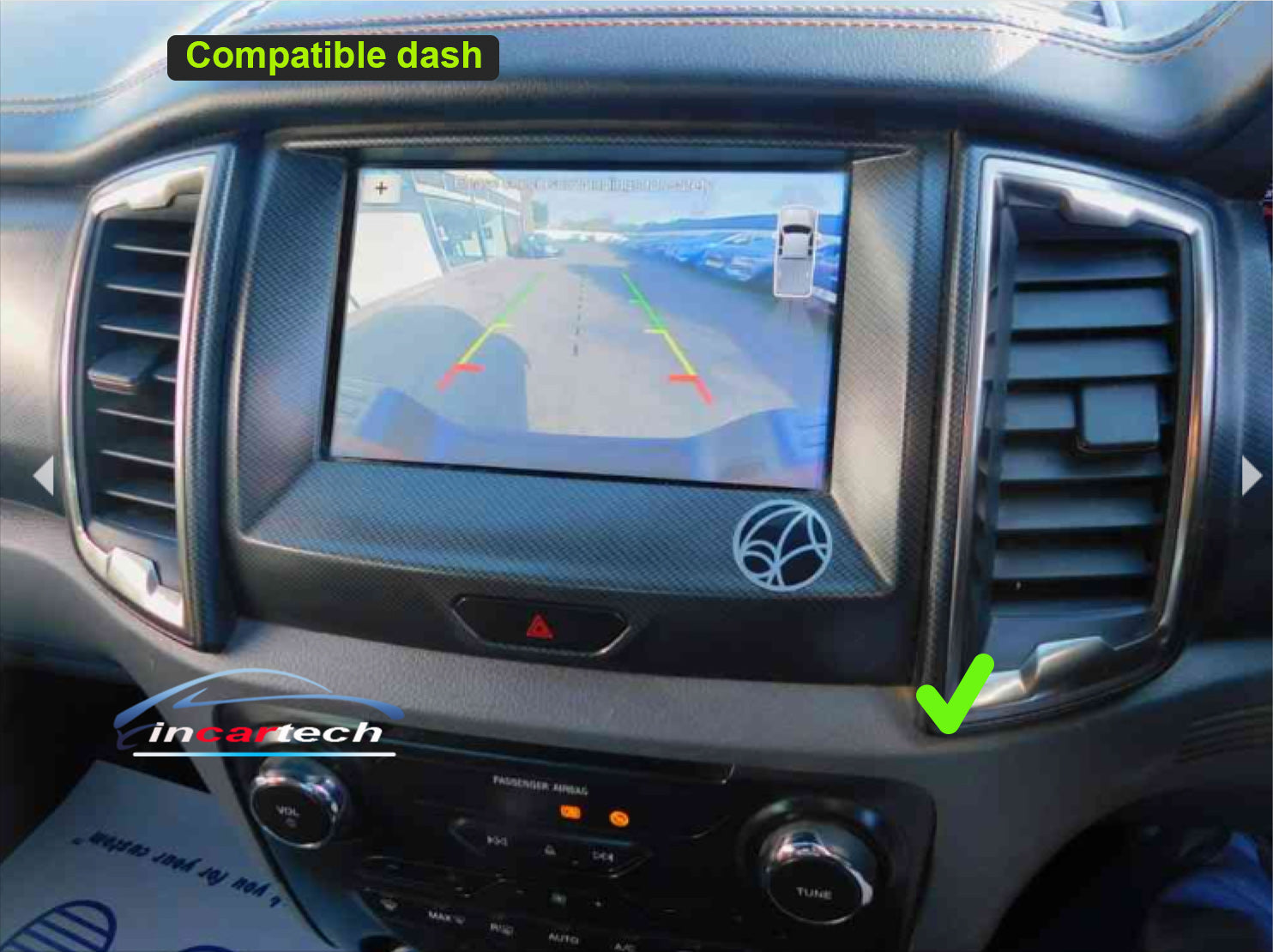 Car dashboard with a navigation screen displaying a compatible dash, featuring the IntacTech logo.