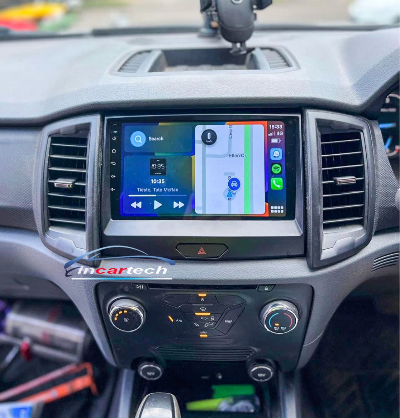 Car dashboard with an Incarcatech infotainment system displaying navigation and music controls.